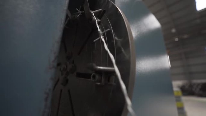 Close-up view of an engine rolling a prickly wire