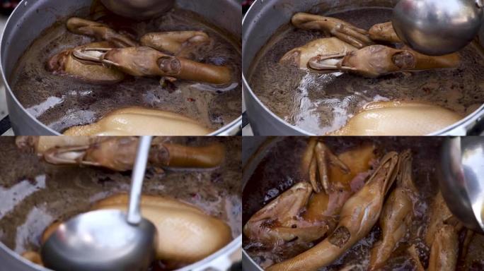 在不锈钢锅中烹饪锅炖鸭，传统锅炖鸭