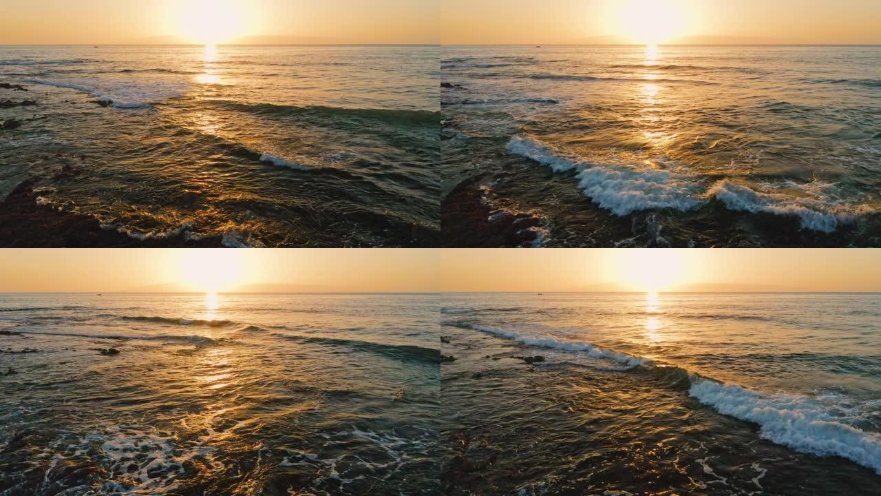 海上美丽的日落。金色清澈海洋咸水表面的太阳路径。晚上的风景。波浪起泡。天堂梦幻岛。
