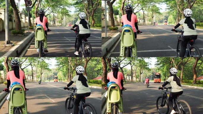骑自行车的穆斯林妇女