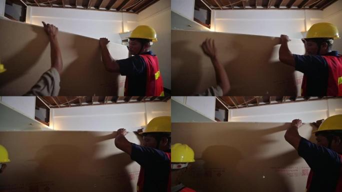 亚洲建筑工人团队为家庭装修工作