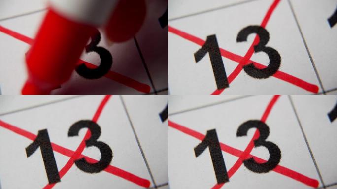 日历中的第13个数字在白纸上的宏中用红叉划掉。计划、笔记、会议日历。商业日历。日历中注释的标记。