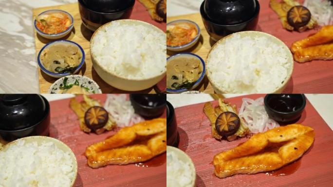 餐厅配有照烧酱和米饭的三文鱼牛排。日本料理: 标准流行套餐。米饭、味噌汤、梅波希、豆腐、烤鱼。准备投
