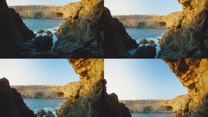 Ajuy洞穴，加那利群岛富埃特文图拉岛的西洋岩石海岸。西班牙，4k。拉佩纳港。火山悬崖。