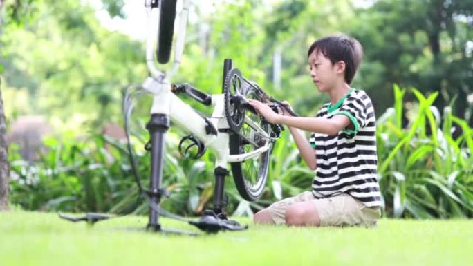 Boy repairing the bicycle