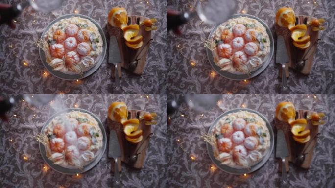 厨师用糖粉粉状橘子蛋白酥皮蛋糕的慢动作特写镜头