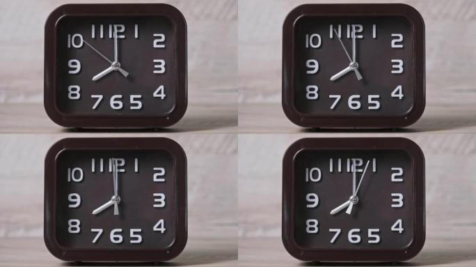 木桌上的指针时钟显示时间
