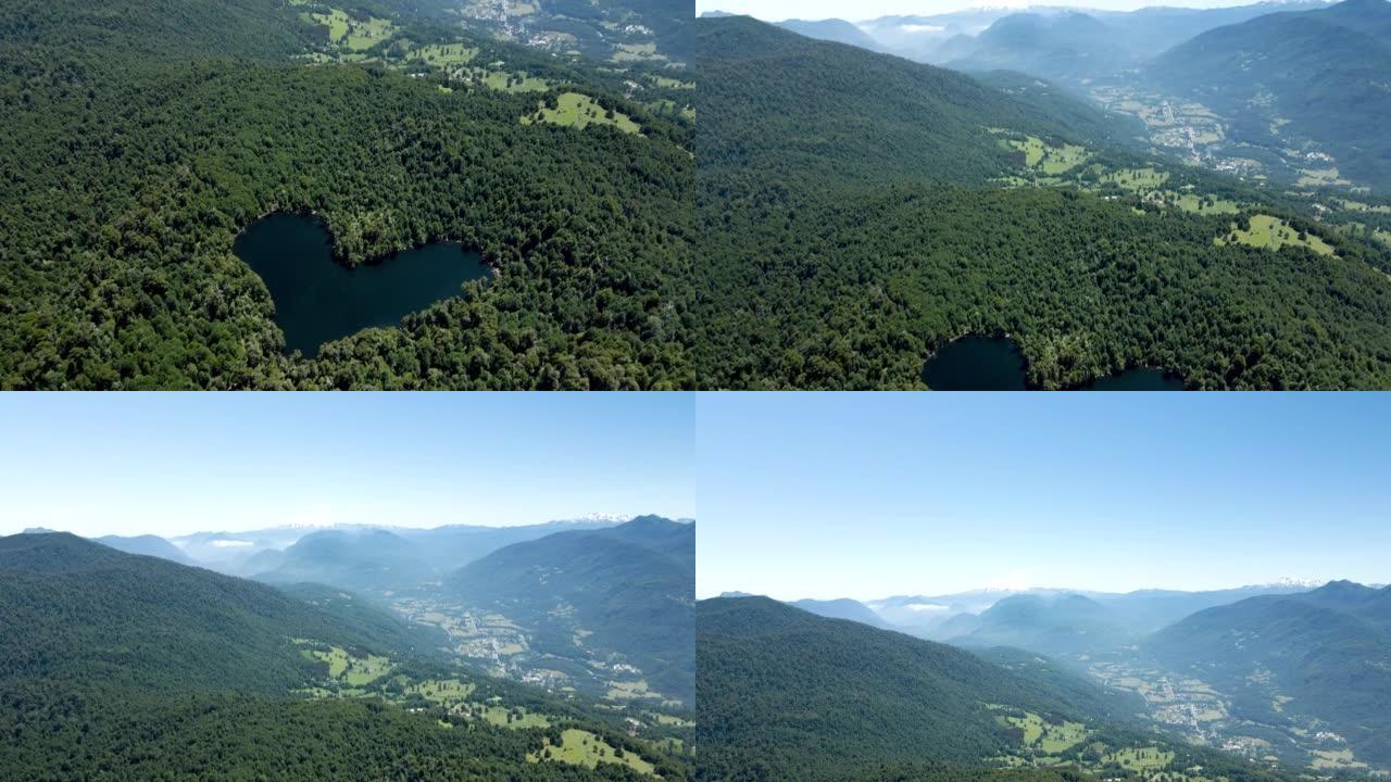 智利利辛的心脏泻湖的鸟瞰图，周围是一片混合森林