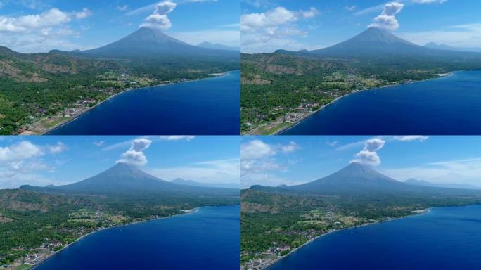 岛屿海岸，背景为黑沙滩和火山爆发