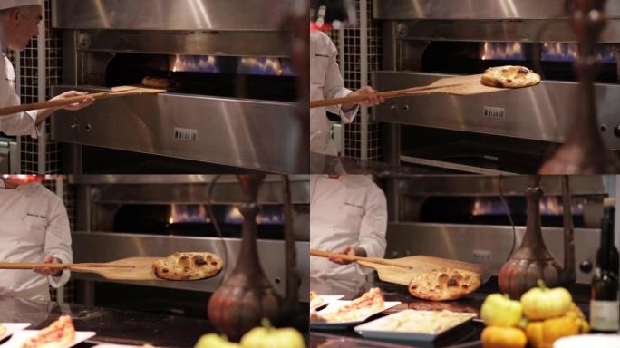 拉马丹皮塔饼刚从烤箱里出来，拉马丹皮塔饼在柜台上，在餐厅的厨房里做面包，餐厅厨师