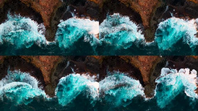 澳大利亚西部的红色虚张声势，quobba站，海浪压在岩石上的鸟瞰图