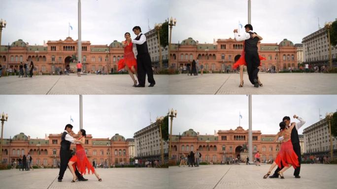 拉丁夫妇在城镇广场上跳探戈