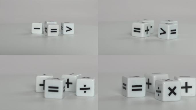 四个带有数学数学符号的白色骰子。