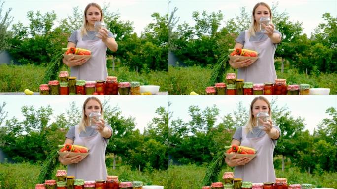 一个女人把蔬菜保存在罐子里。选择性聚焦。食品。