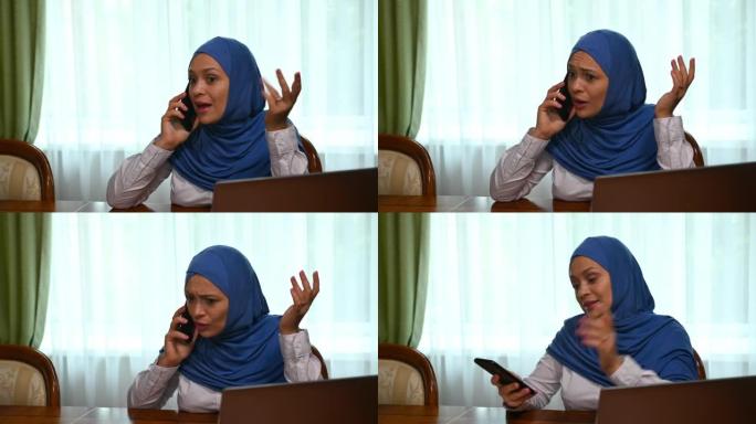 多任务的阿拉伯穆斯林年轻妇女在手机上讲话，在电话交谈失败时感到焦虑
