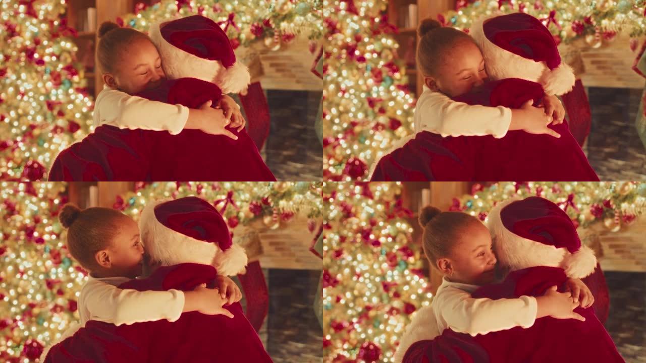 拥抱圣诞老人的小女孩