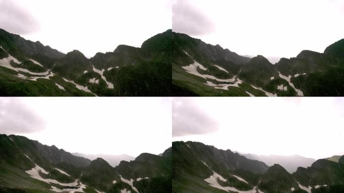 飞越山峰的空中飞行镜头史诗全景自然成功登顶山峰。