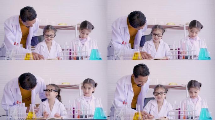 4K，白色实验室衬衫的小胡子老师正在学校实验室里教一个小女孩科学和色彩混合。女孩在笔记本上写字。概念