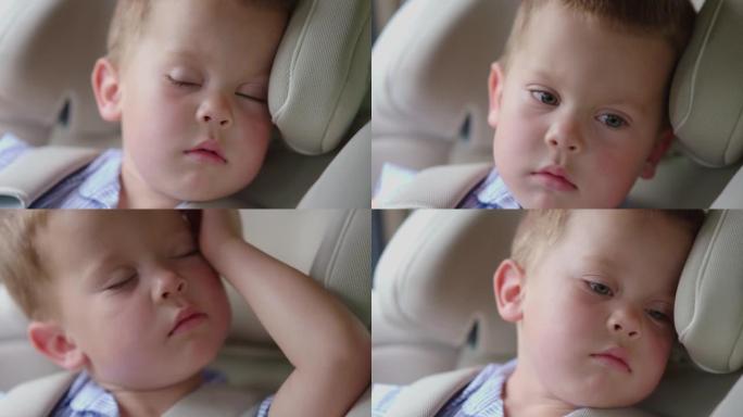 唤醒坐在车内汽车座椅上的孩子。唤醒男婴打开