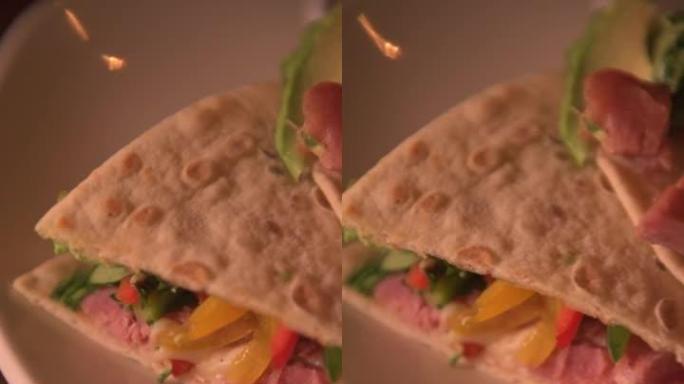 金枪鱼肉皮塔的温暖视频。阿拉伯玉米卷概念。墨西哥阿拉伯食品的垂直视频