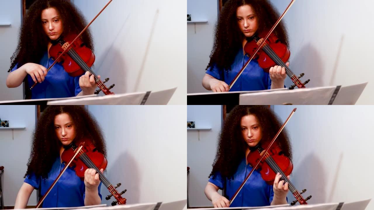 女孩小提琴家在家里演奏小提琴音乐会