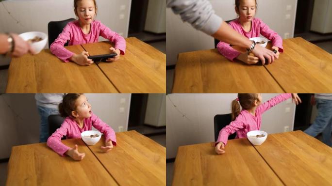 小女孩在智能手机上玩游戏