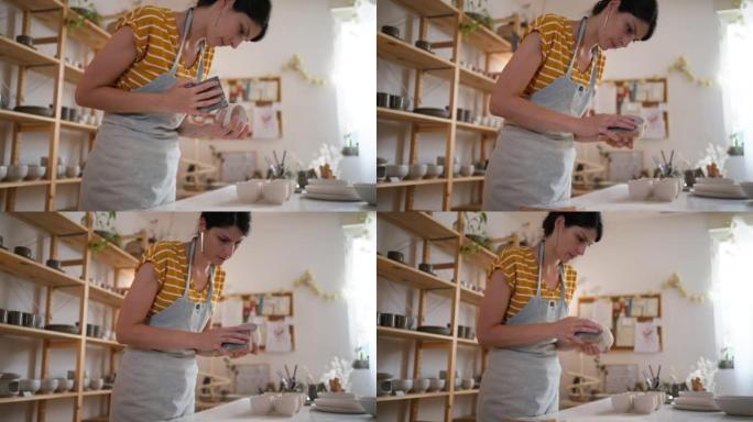 高加索女陶工，用砂纸打磨陶器