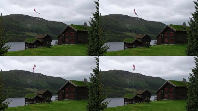 挪威美妙的风景。Aust Agder。草屋顶房屋的美丽风景。挪威传统建筑山脉、树木和雪背景4K UH