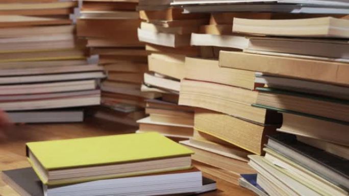 Piles of books on desk