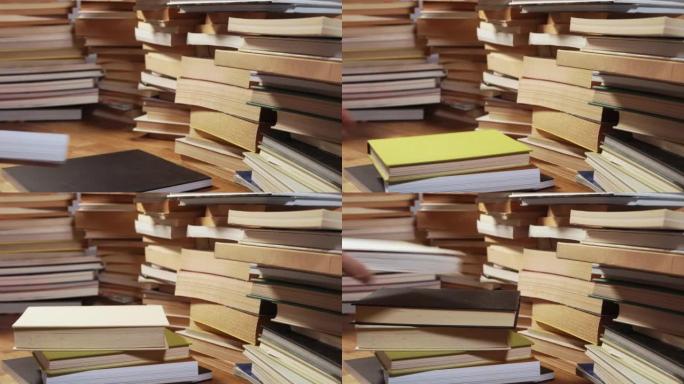 Piles of books on desk