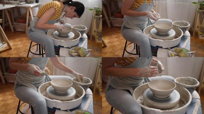女陶工，在陶器作坊制作陶器