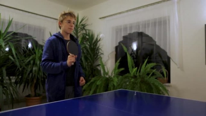 Teenage kids playing table tennis at home