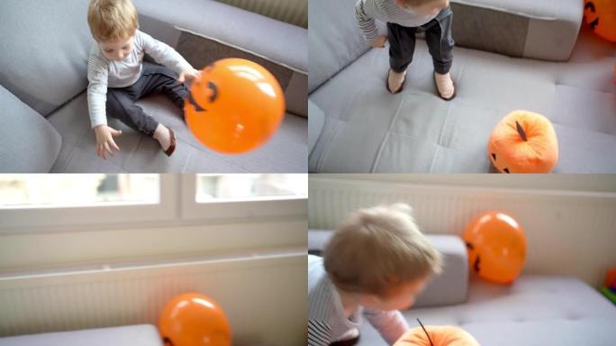 高加索蹒跚学步的男孩玩气球，庆祝万圣节