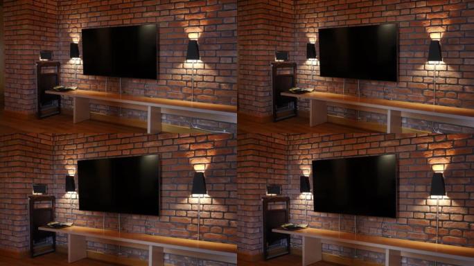 现代电视机挂在砖墙上，灯照在一边。室内舒适舒适的旅游胜地，没有人。现代技术和服务理念。