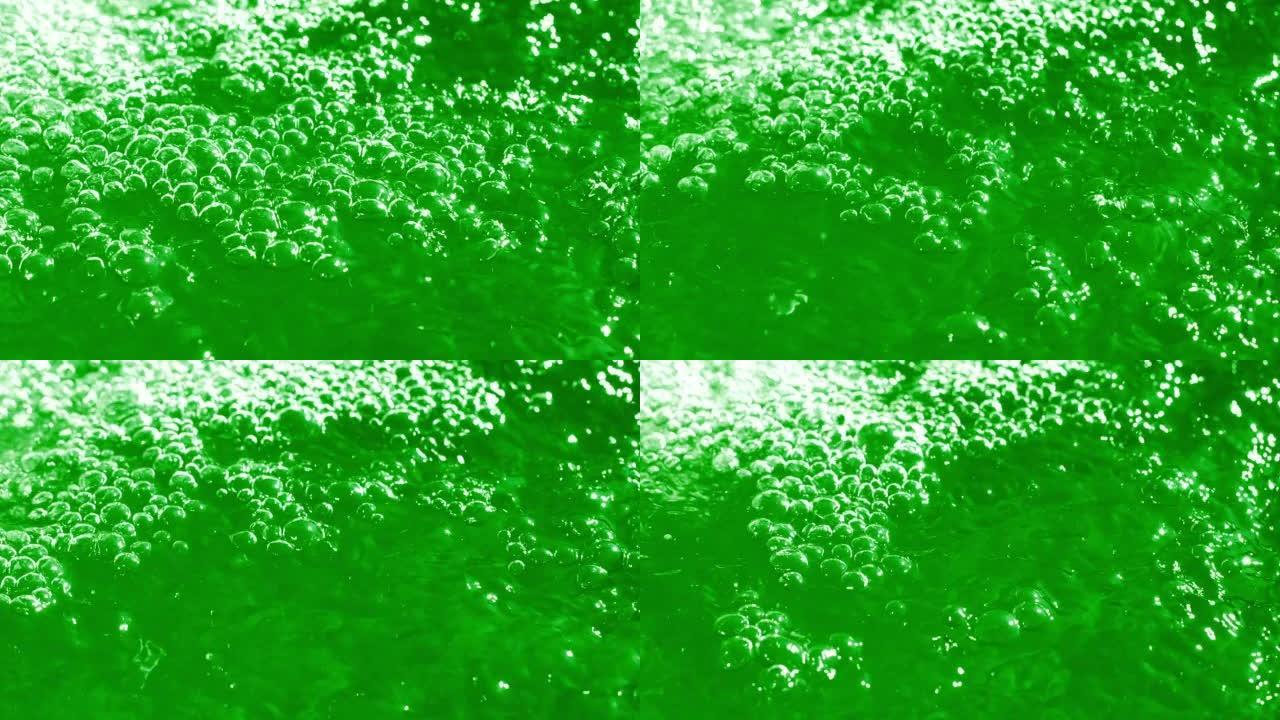 绿色背景上的水上气泡特写