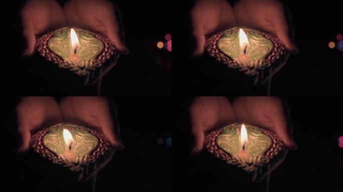 用手中的迪帕克蜡烛庆祝排灯节快乐