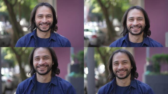 一个快乐的西班牙裔男子微笑着向前走。白天在城市街道上的南美巴西人肖像特写镜头