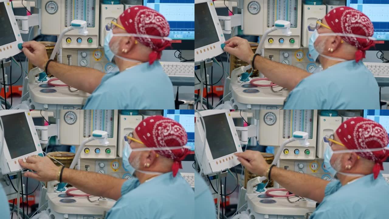 麻醉师在手术过程中看着患者的生命体征监测器