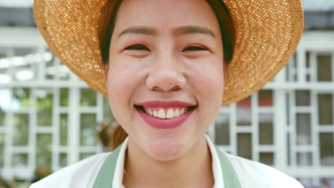 亚洲年轻女性中小企业小企业企业家作为仙人掌植物农场主人微笑的肖像