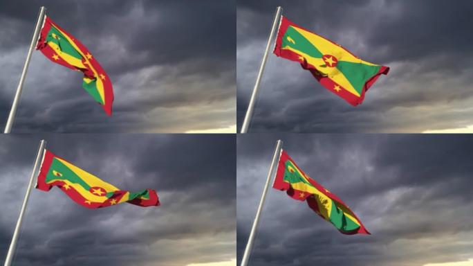 格林纳达国旗在狂风预报背景下在巨大的日出云上挥舞
