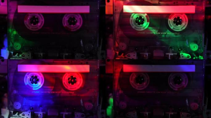 复古盒式磁带甲板录音机。彩色迪斯科灯照亮了盒式磁带。