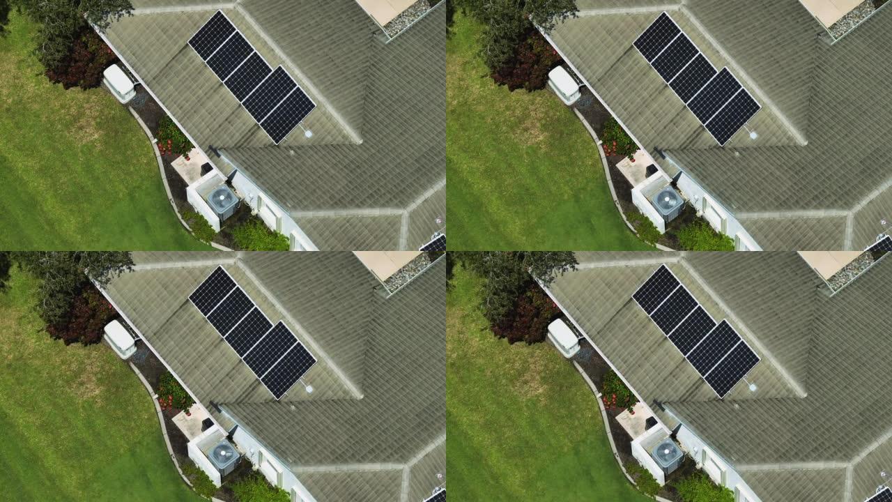 美国典型建筑屋顶鸟瞰图，一排排蓝色太阳能光伏板生产清洁生态电能。零排放概念的可再生电力