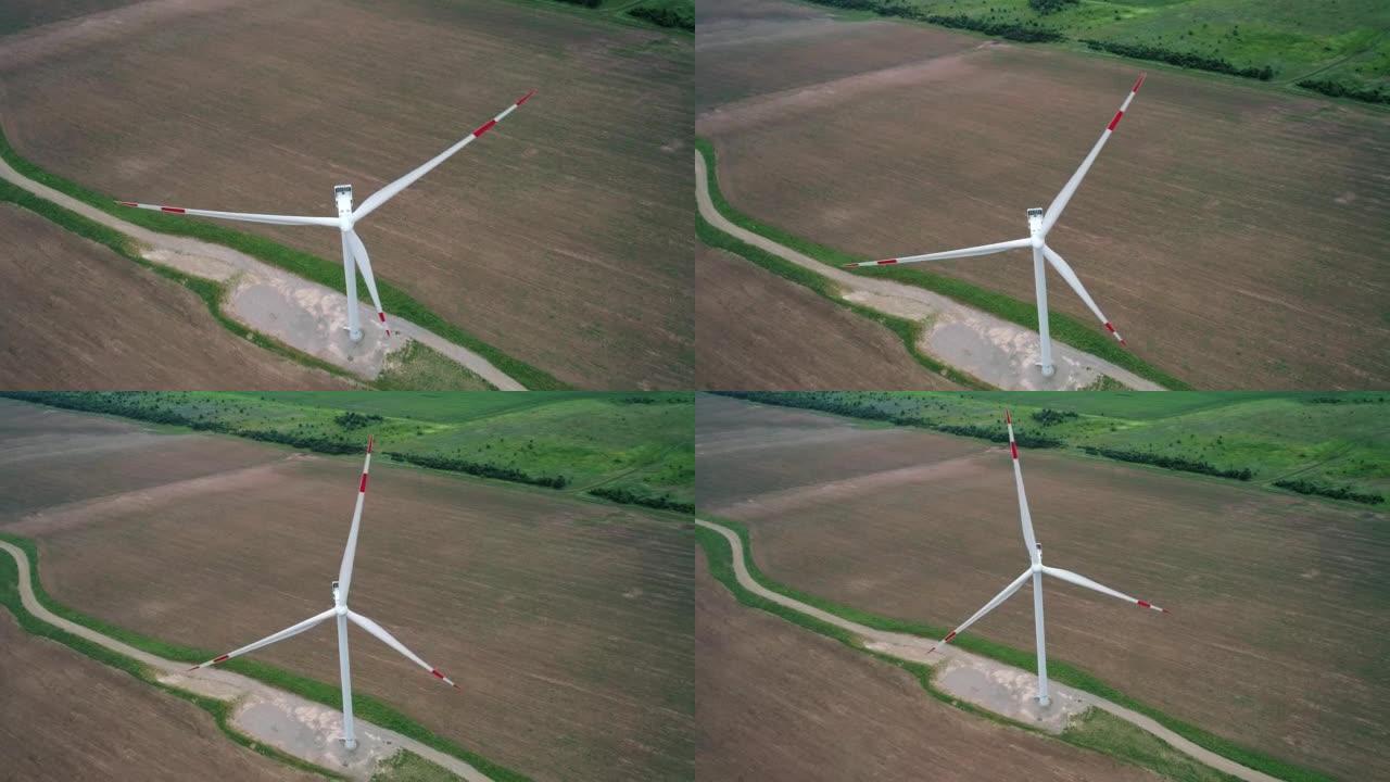 风车的鸟瞰图。世界能源电力危机。绿色能源生产理念。产生清洁可再生能源的风力涡轮机。特写倾斜镜头