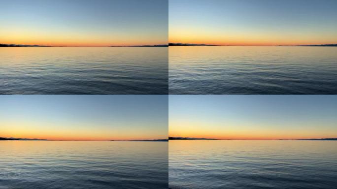 美丽的明亮橙色日落在海洋地平线的背景下丰富的红橙色沉默平静和放松的夜晚在太平洋温哥华岛旅游目的地