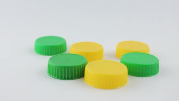 Plastic caps are green and yellow. Plastic caps fr