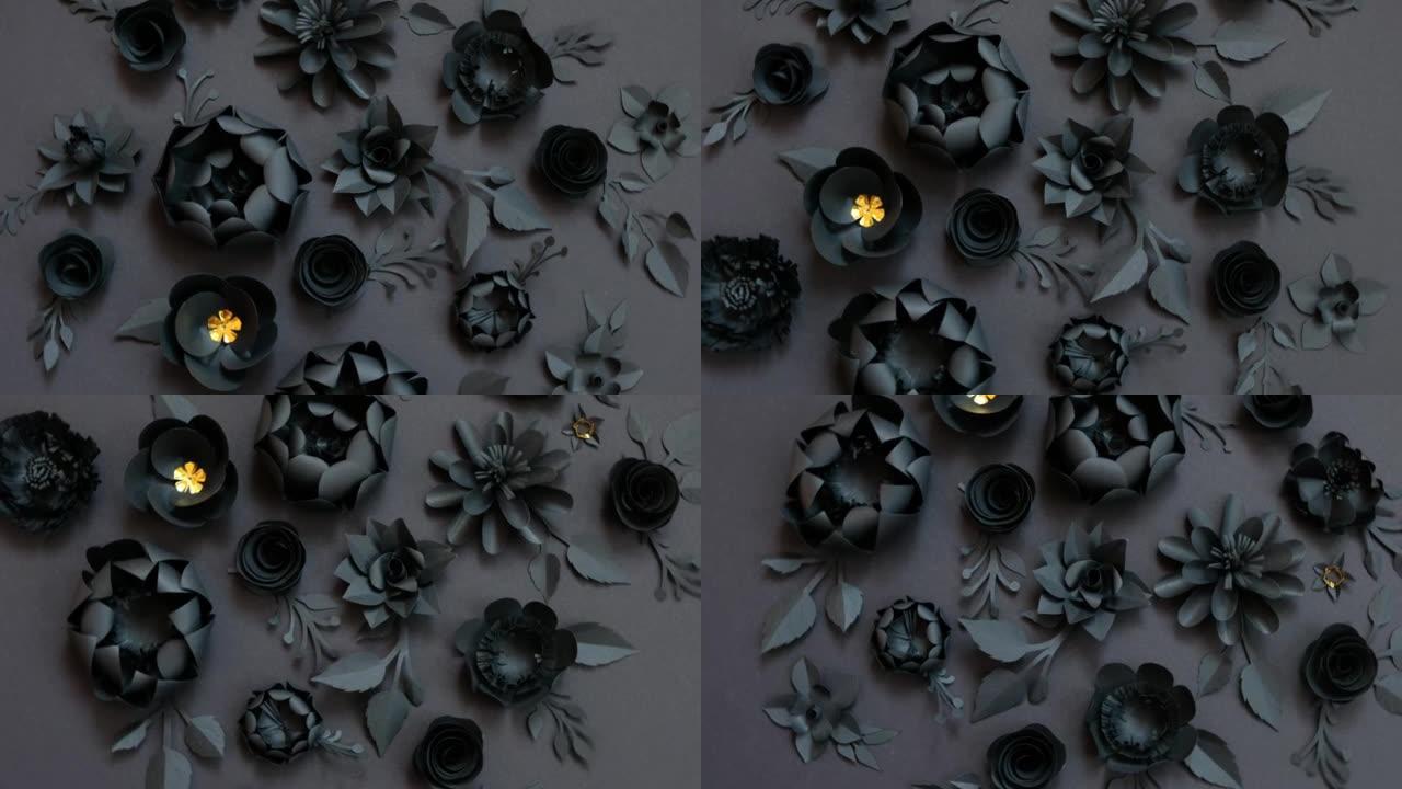 黑色背景上的黑色纸花。从纸上剪下。