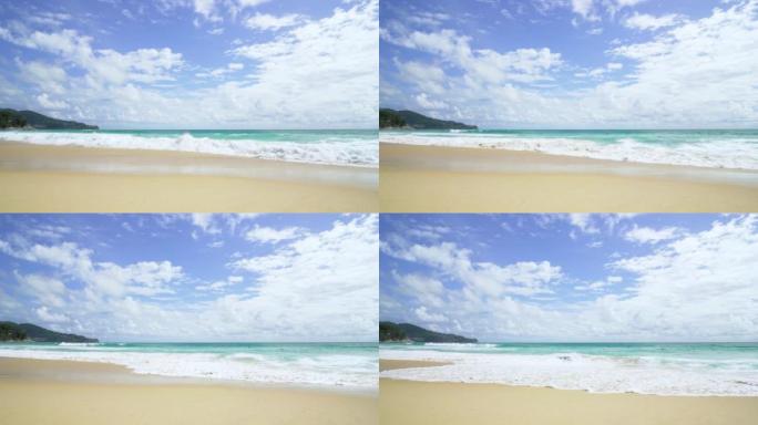 全景热带海滩空间白沙云日光山背景。视频4k分辨率。