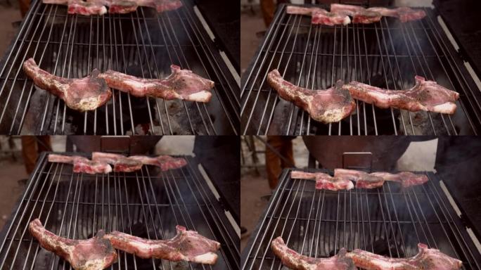 烹饪生猪排和排骨牛排在花园户外派对食物的炉子烧烤烤架上烧烤