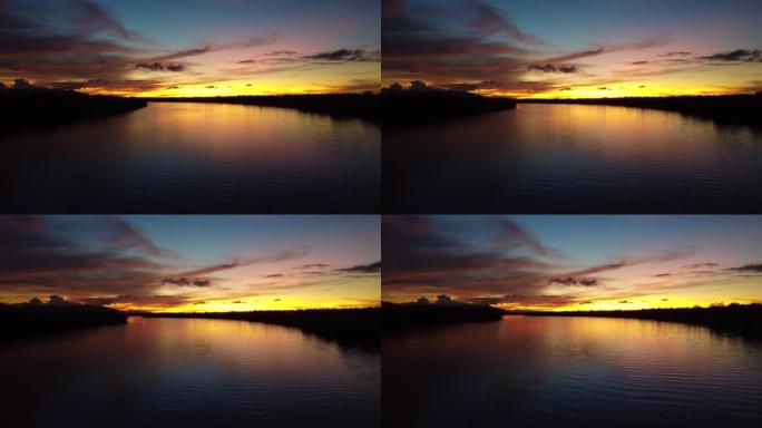 马来西亚砂拉越古晋美丽的日落和萨拉克河的鸟瞰图
