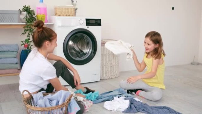 Girls are playing during laundry